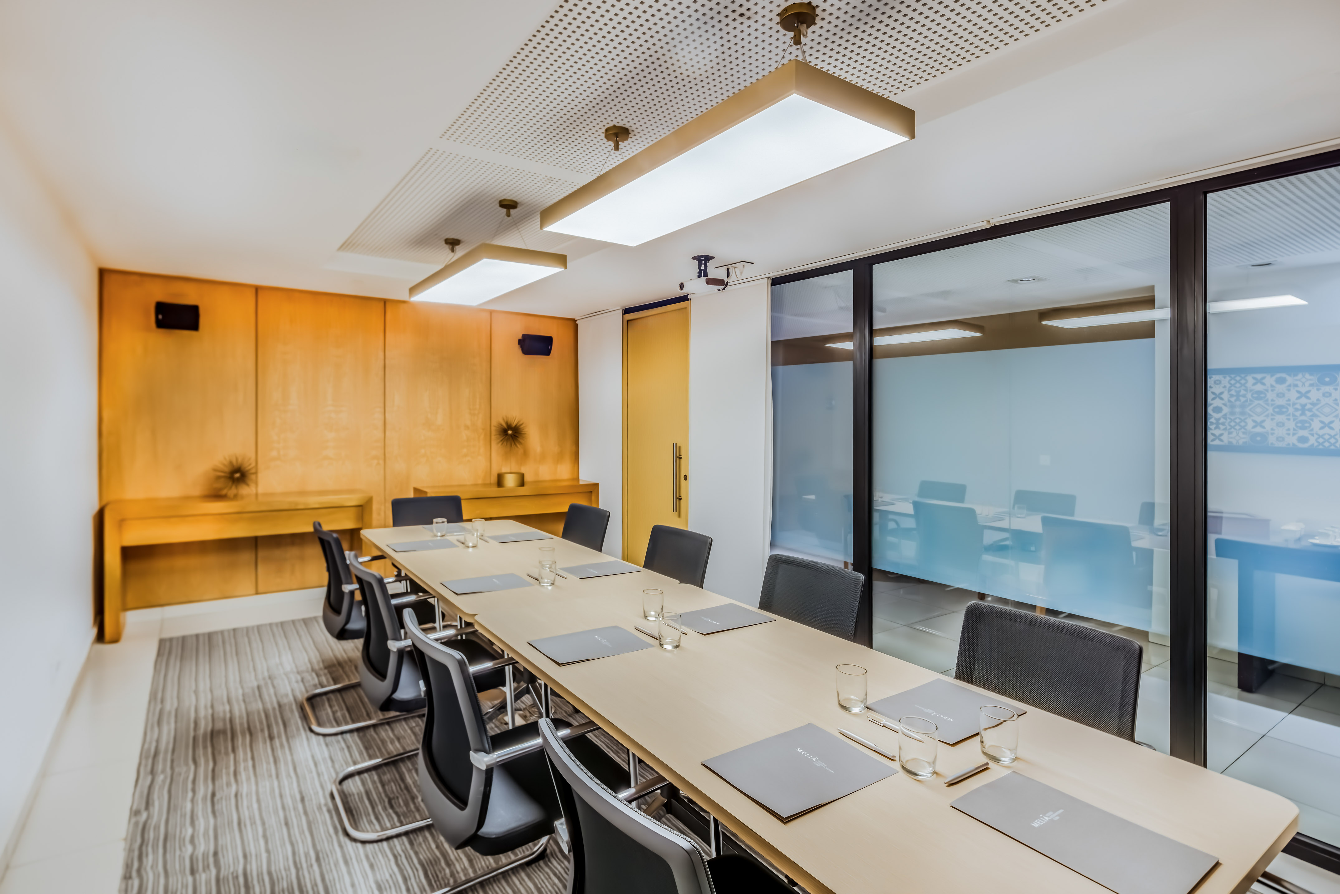 a conference room with a table and chairs