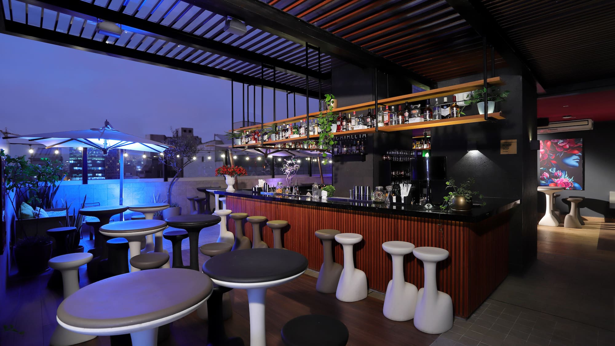 a bar with stools and tables