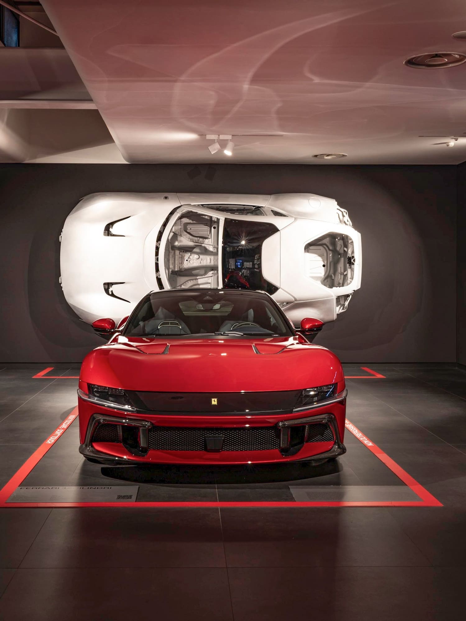 a red sports car in a garage