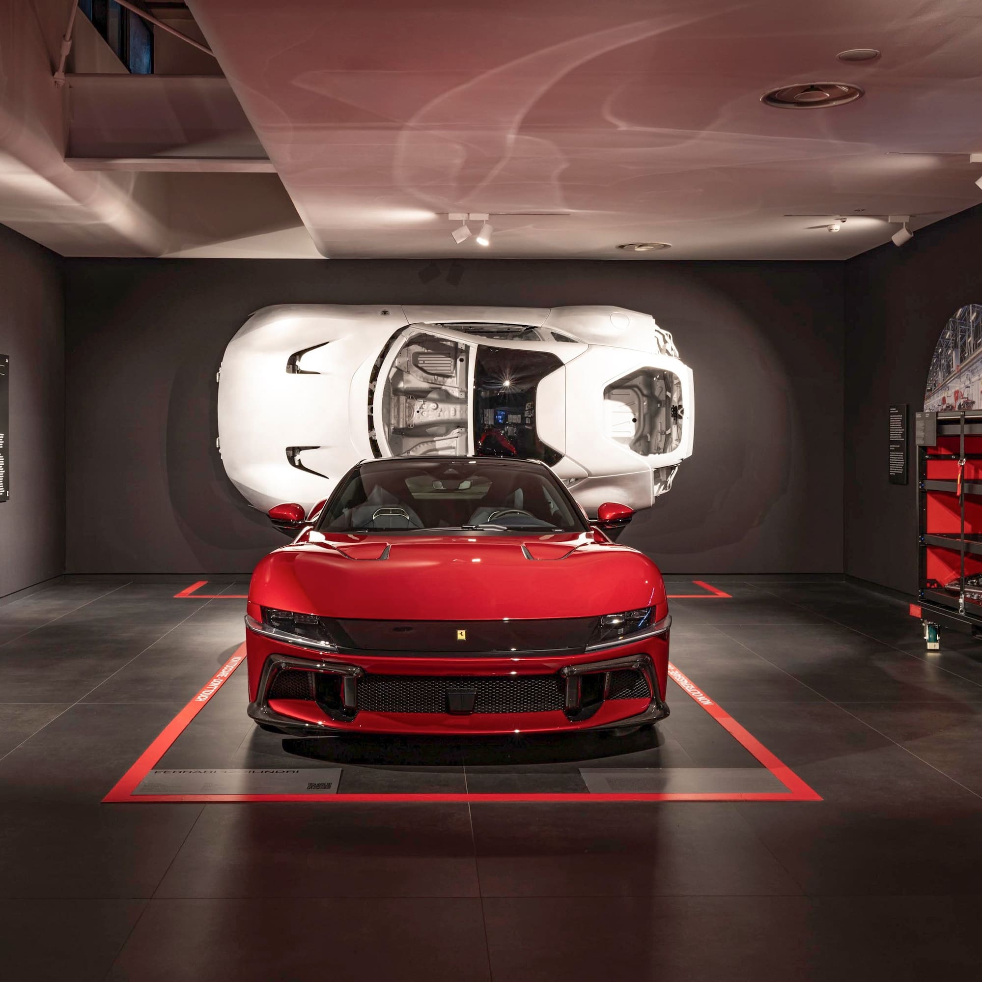 a red sports car in a garage