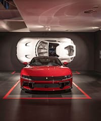 a red sports car in a garage