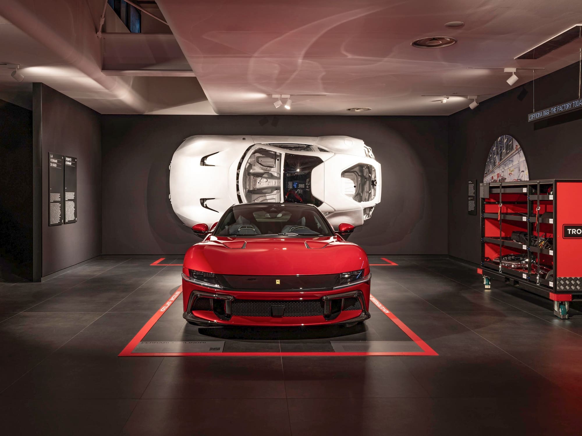 a red sports car in a garage