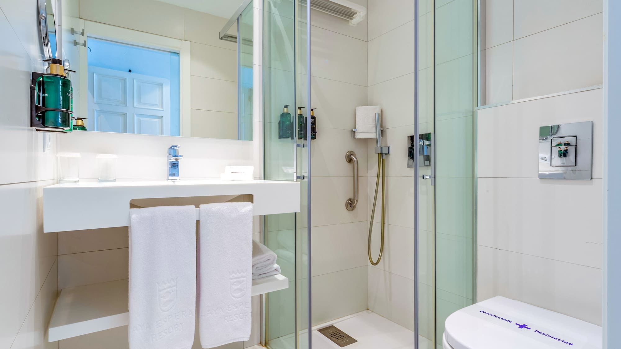 a bathroom with a shower and toilet