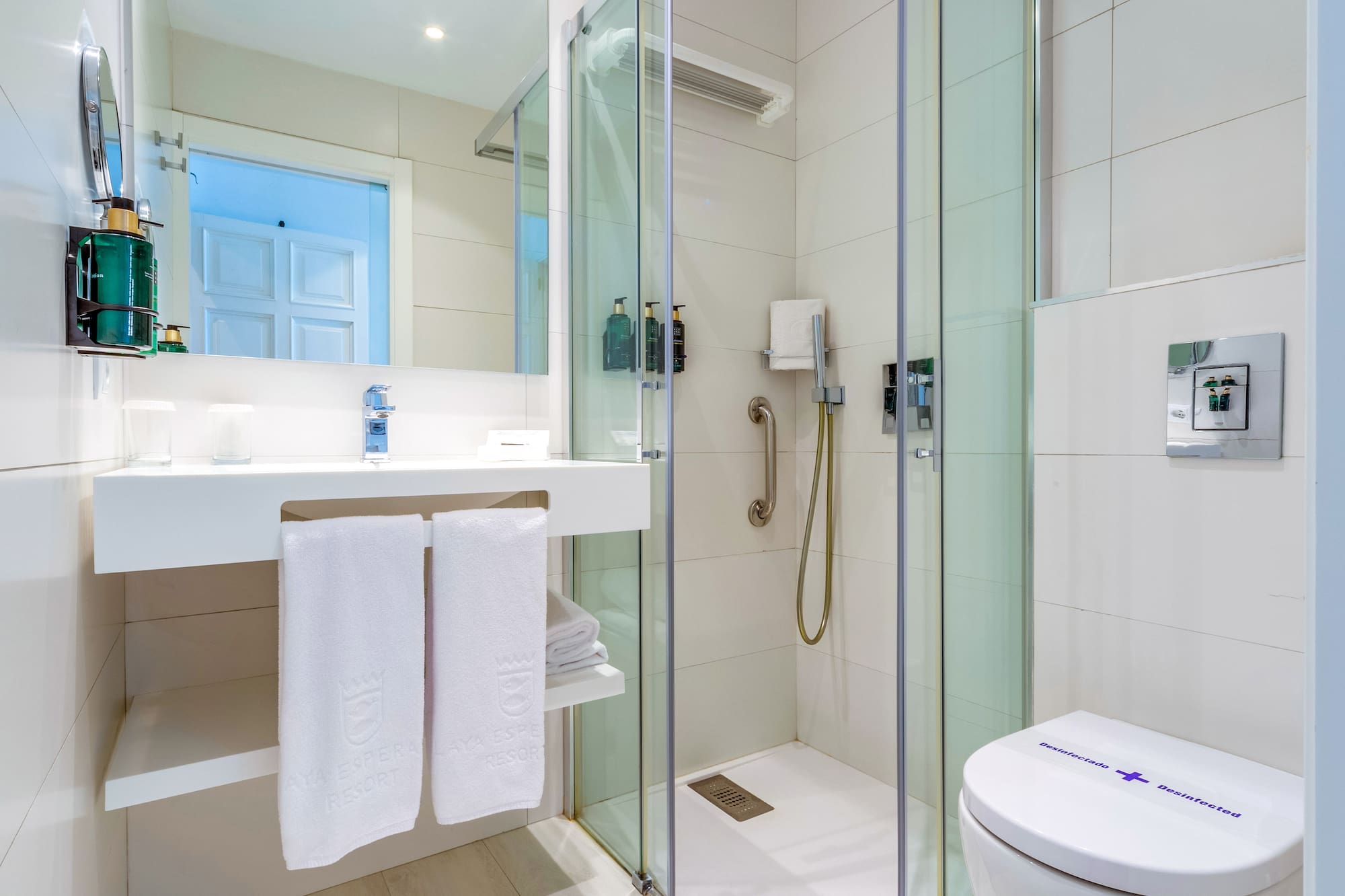 a bathroom with a shower and toilet