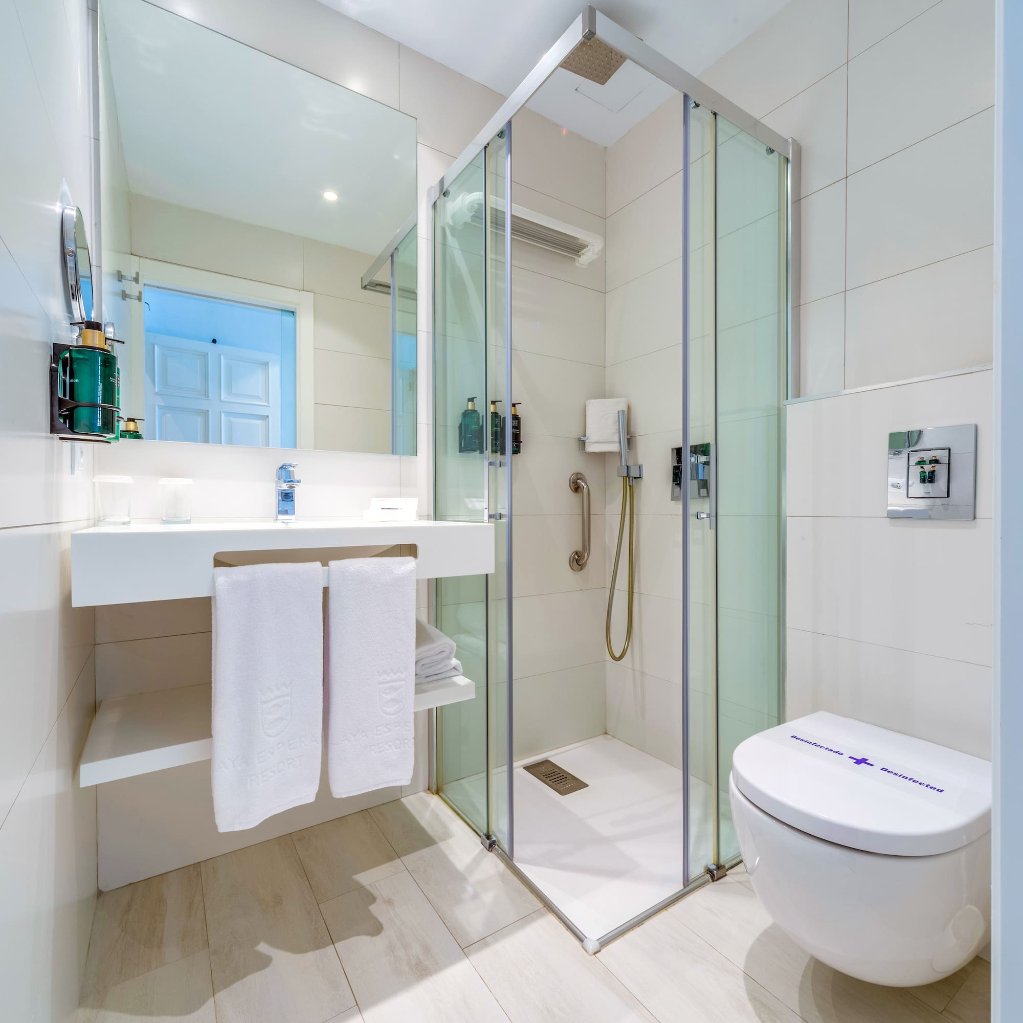 a bathroom with a shower and toilet