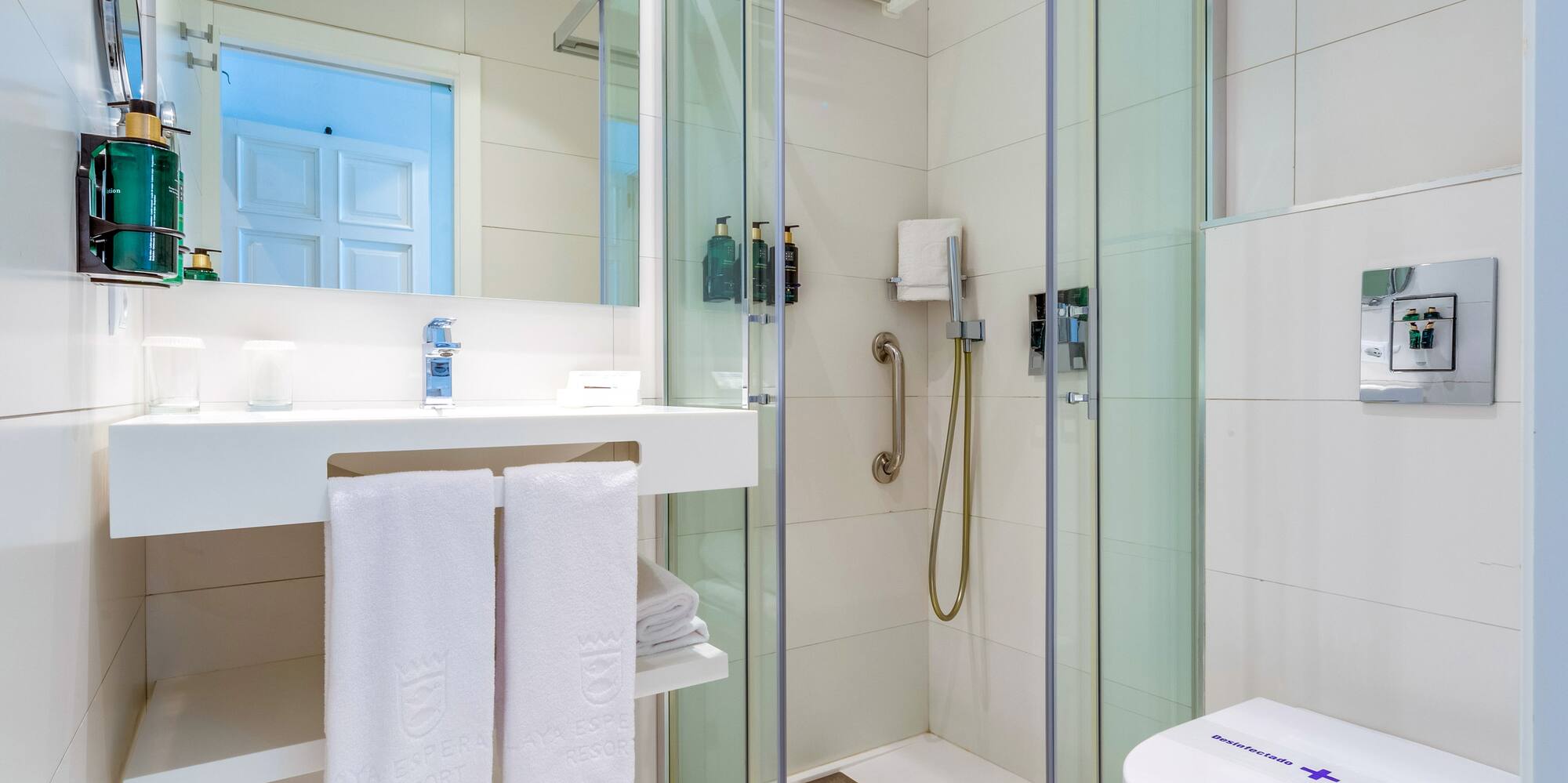 a bathroom with a shower and toilet