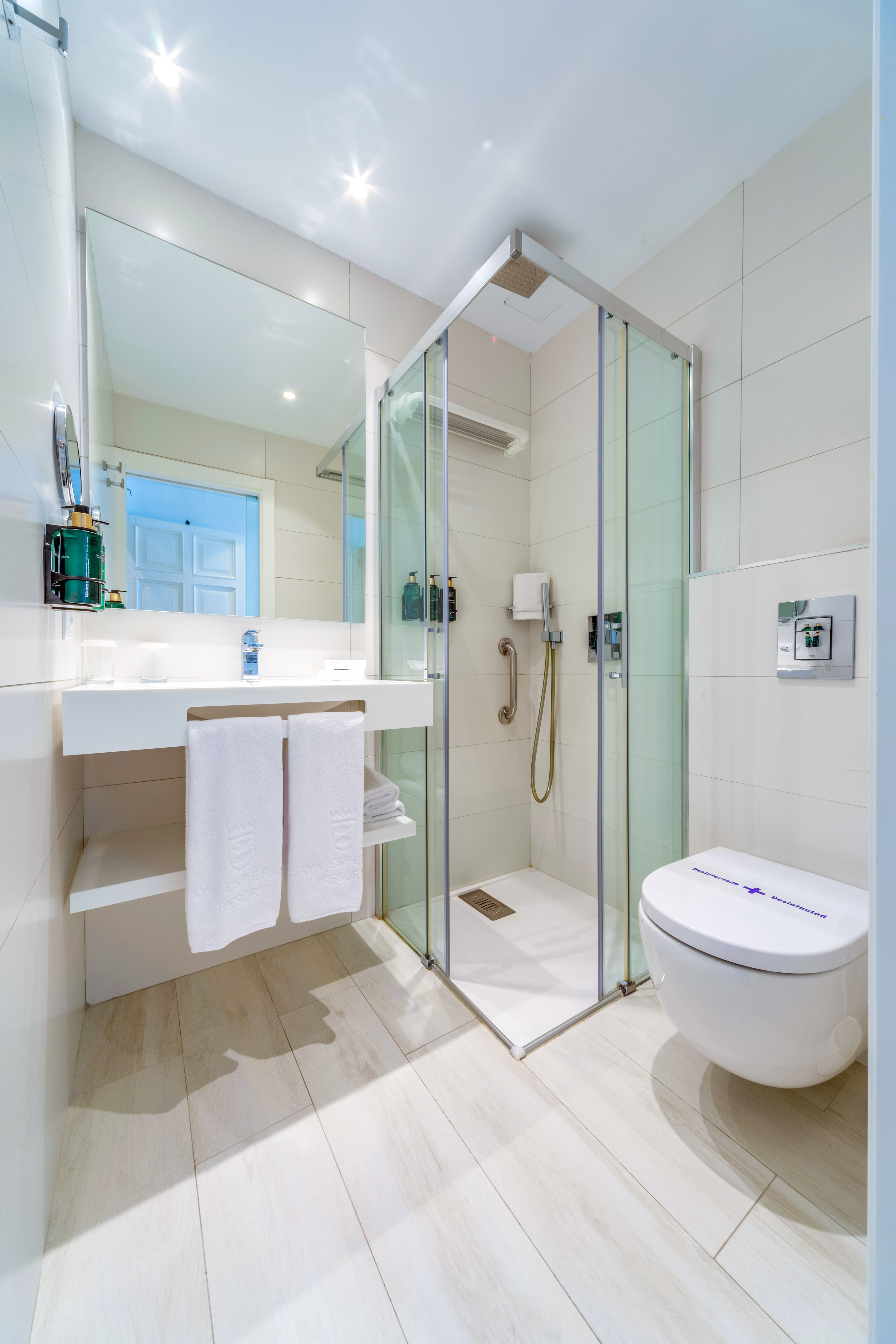 a bathroom with a shower and toilet