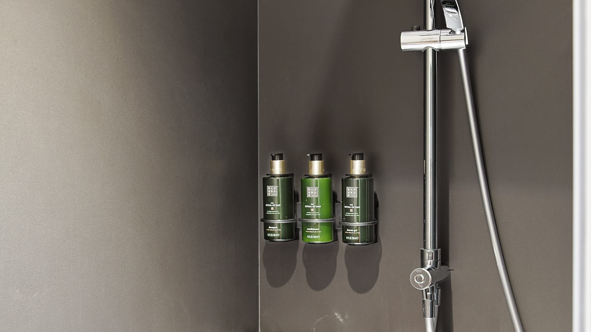 a shower with a shower head and shower head