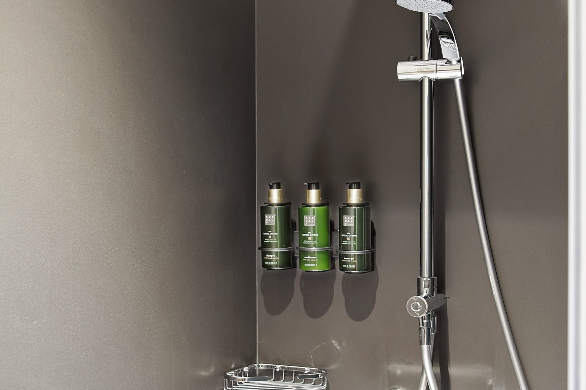 a shower with a shower head and shower head