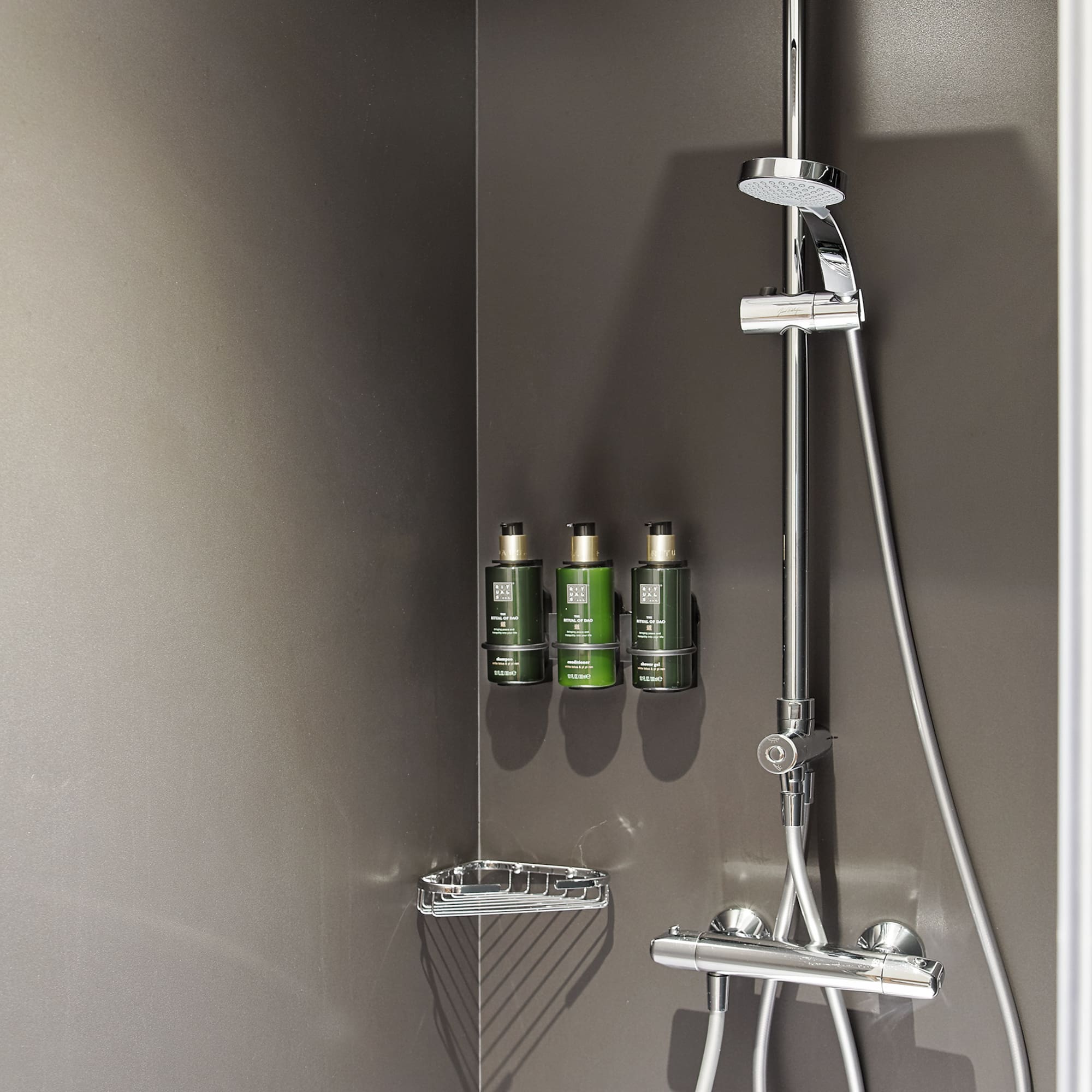 a shower with a shower head and shower head