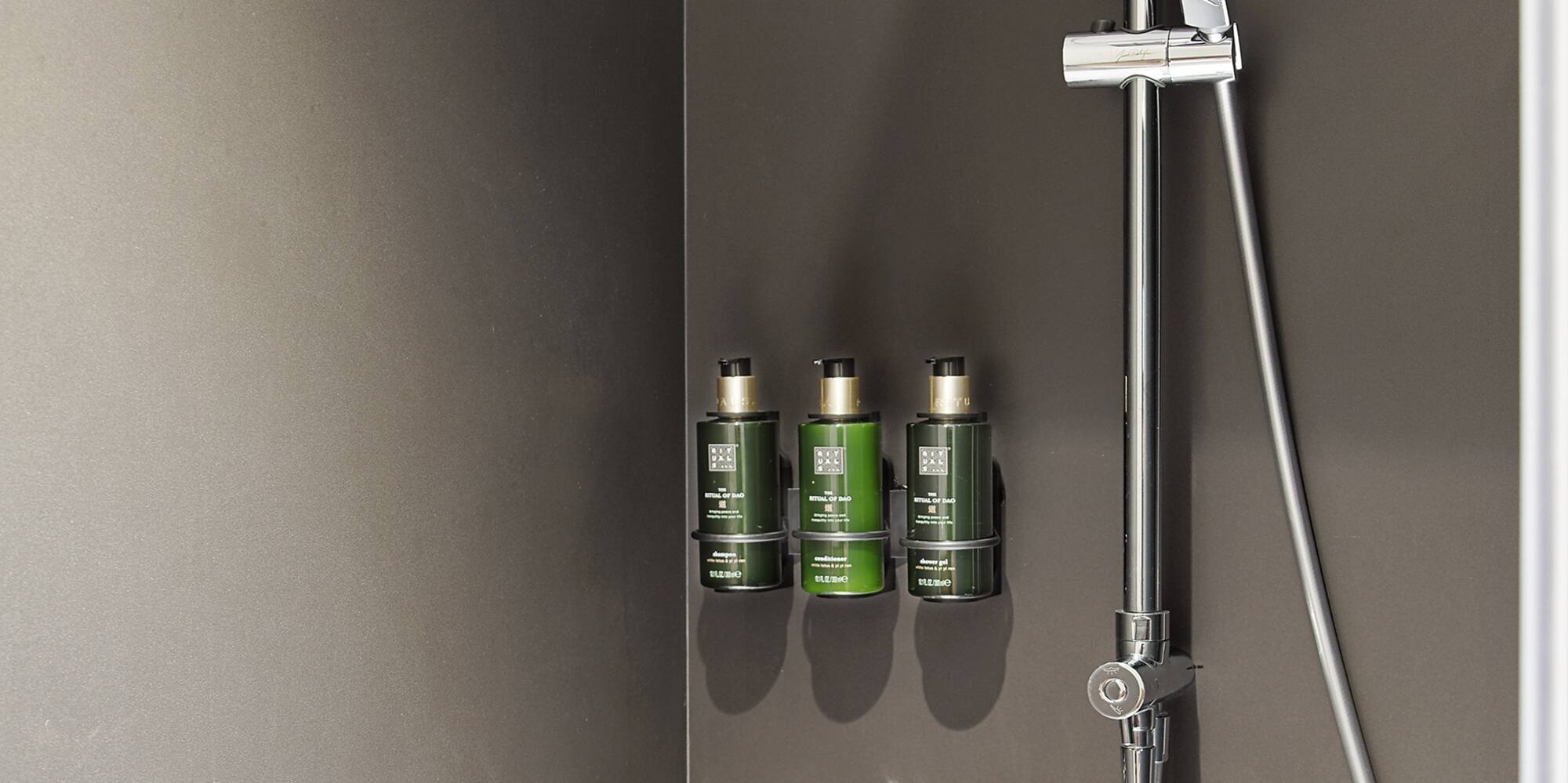 a shower with a shower head and shower head