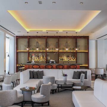 a room with a bar and a white couch