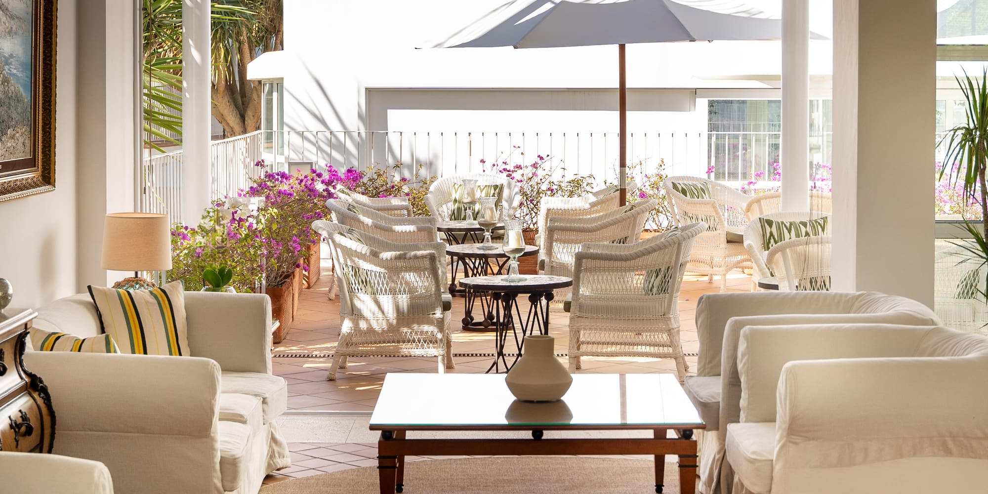 a patio with chairs and a table