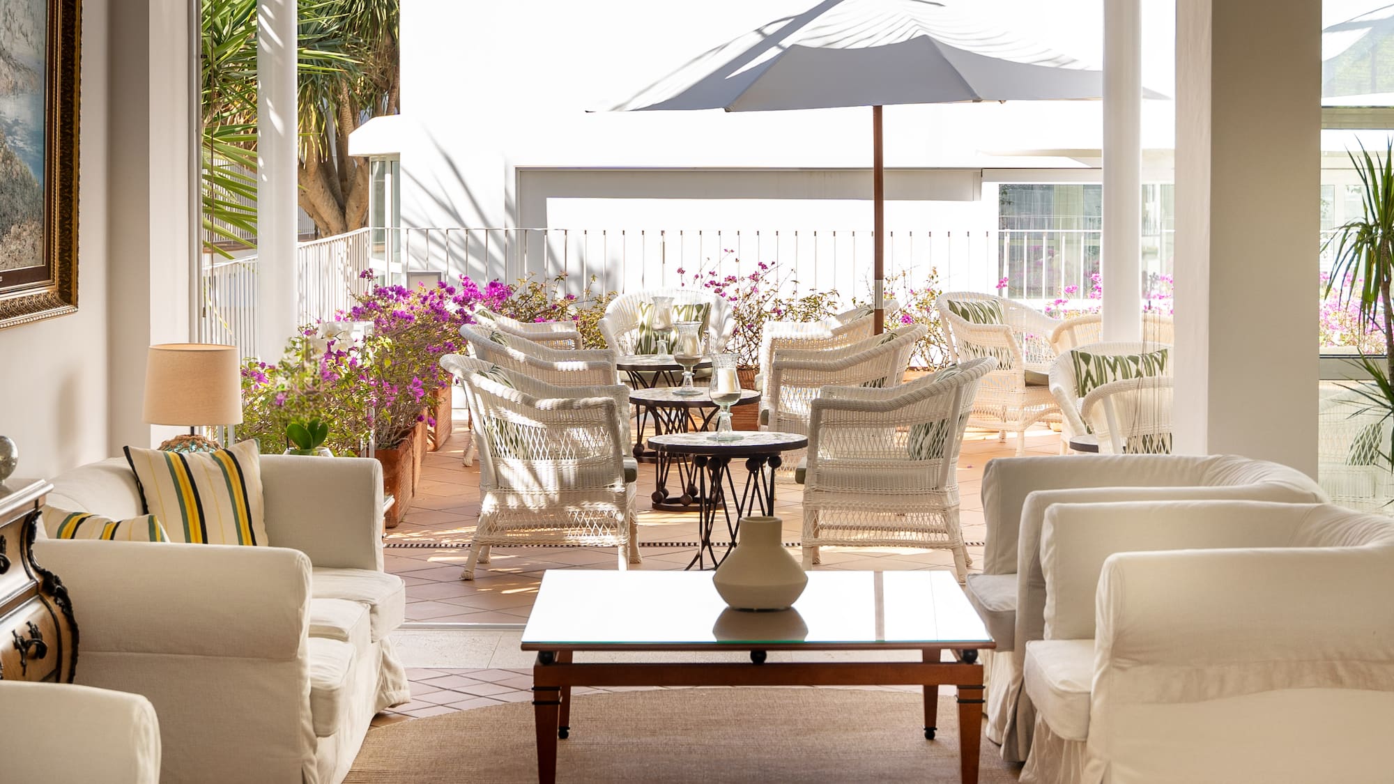 a patio with chairs and a table