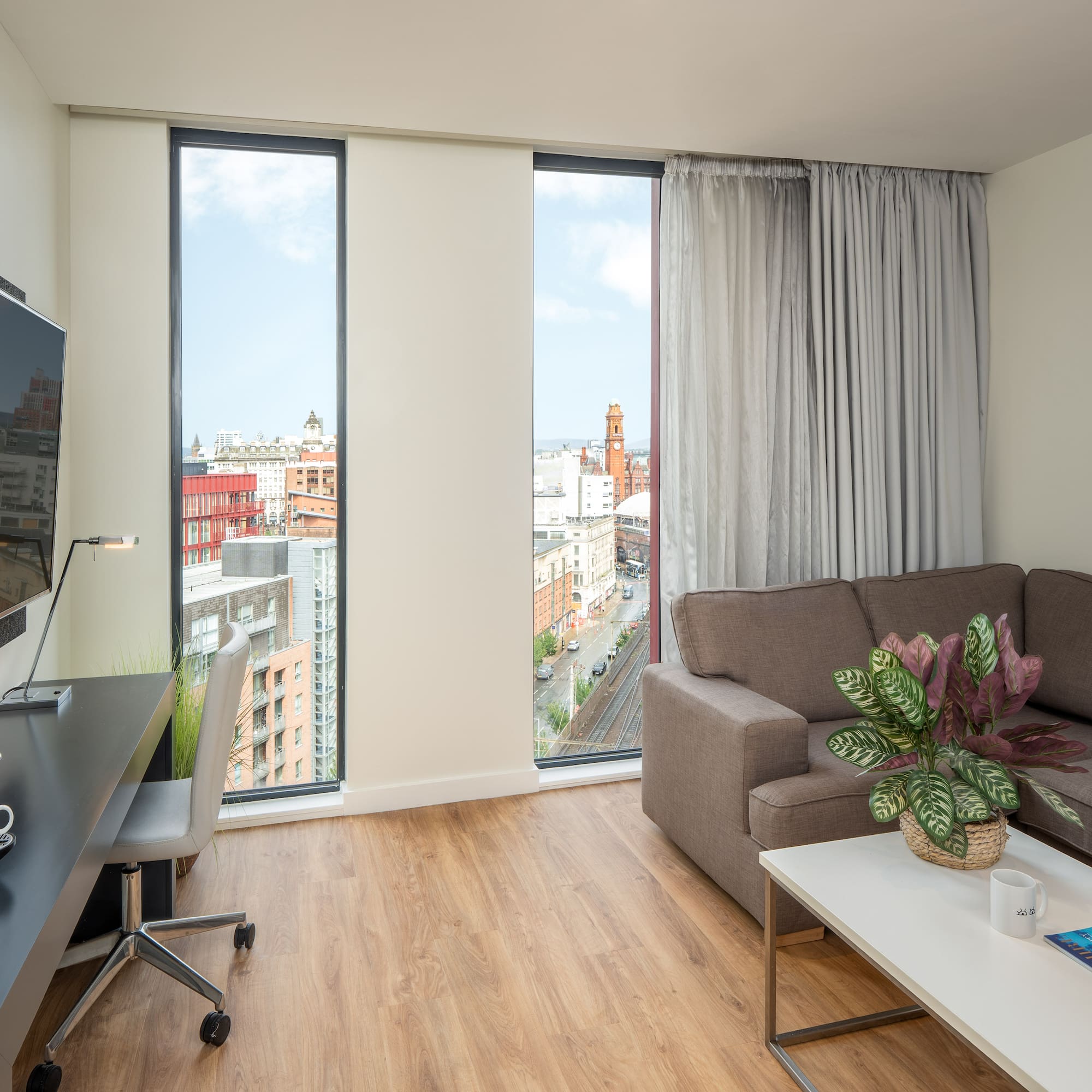 a living room with a couch and a tv