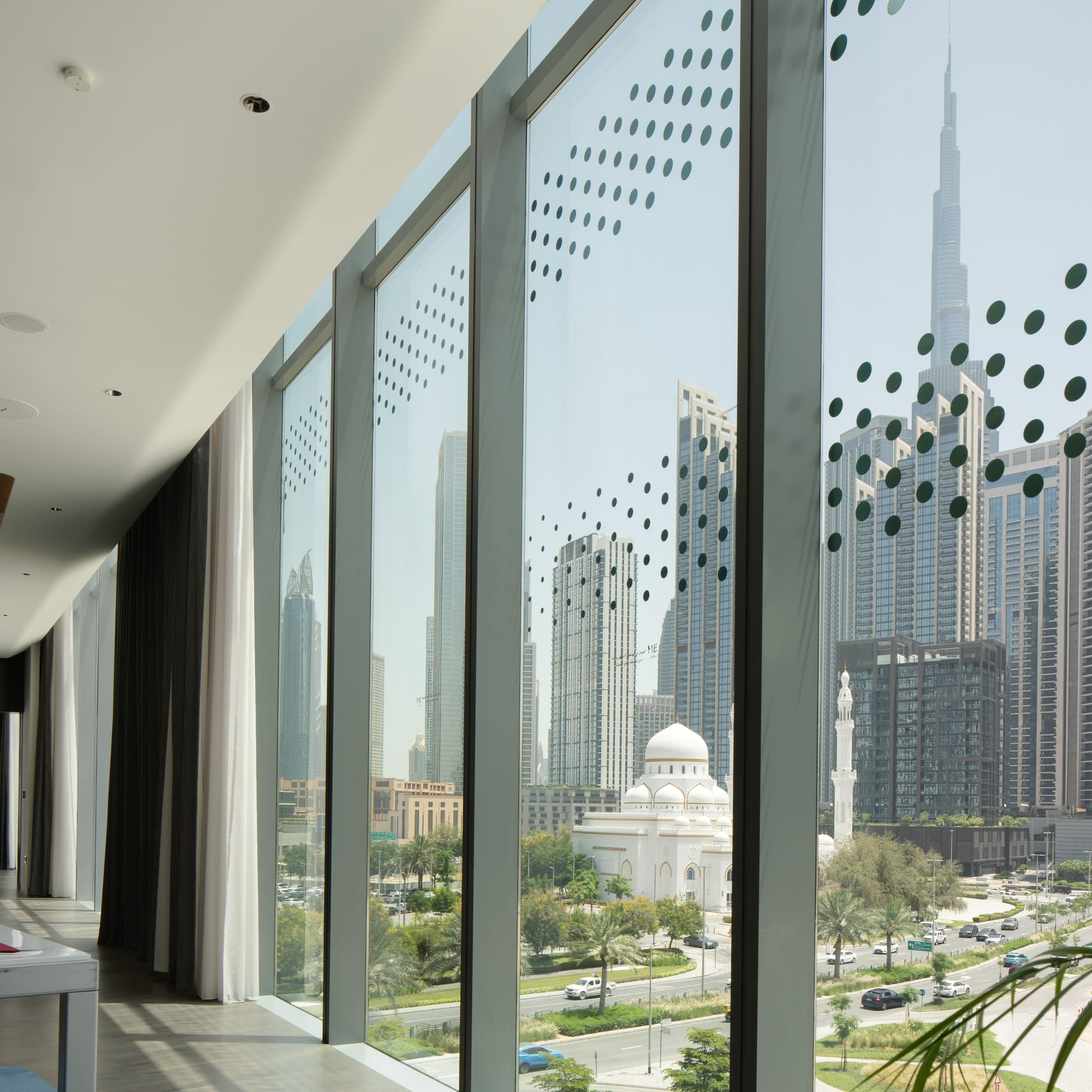 a large window with a view of a city