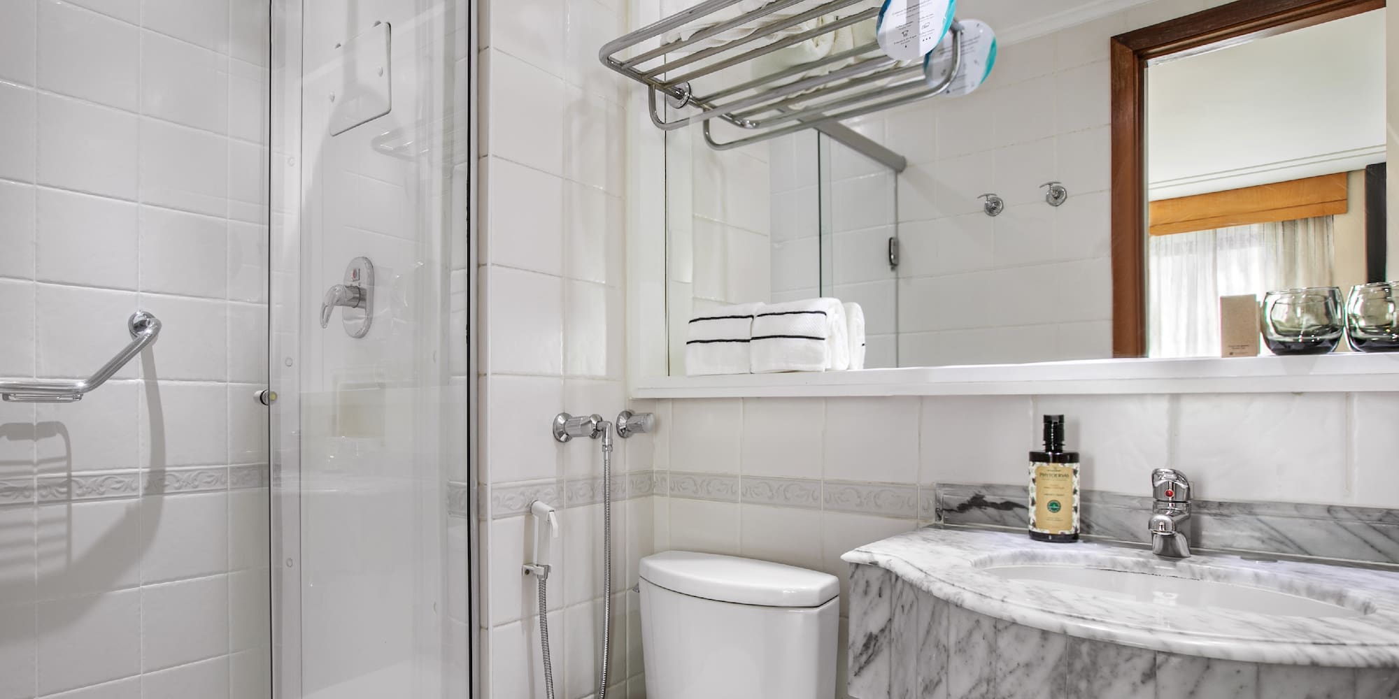 a bathroom with a shower and toilet