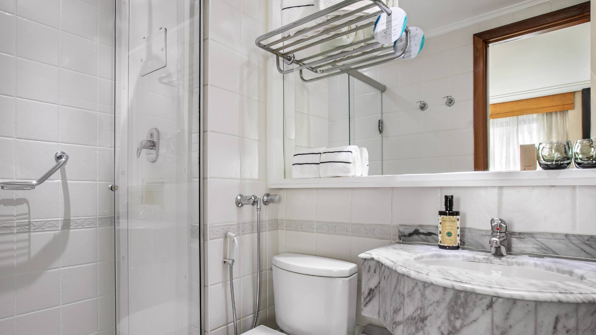 a bathroom with a shower and toilet