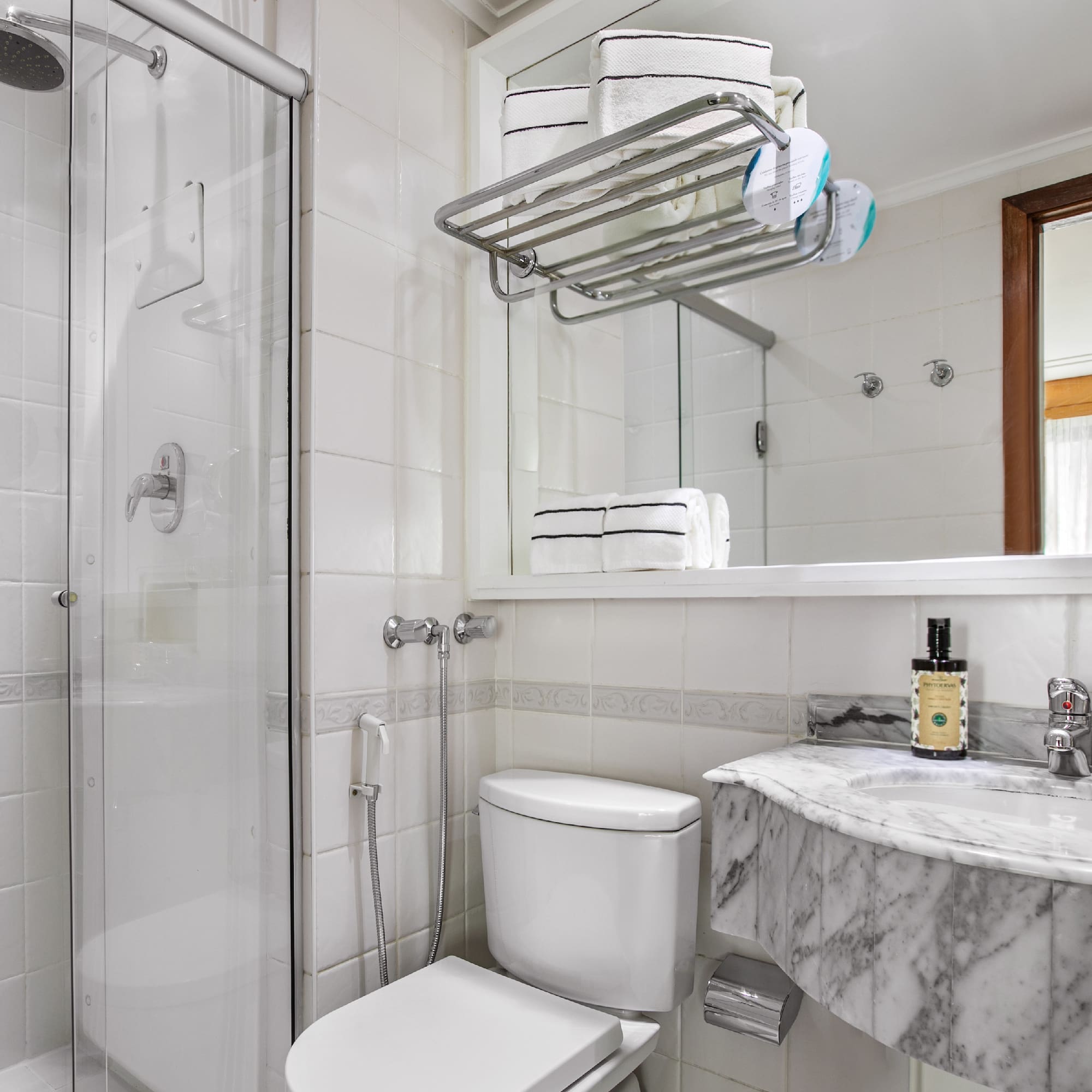 a bathroom with a shower and toilet