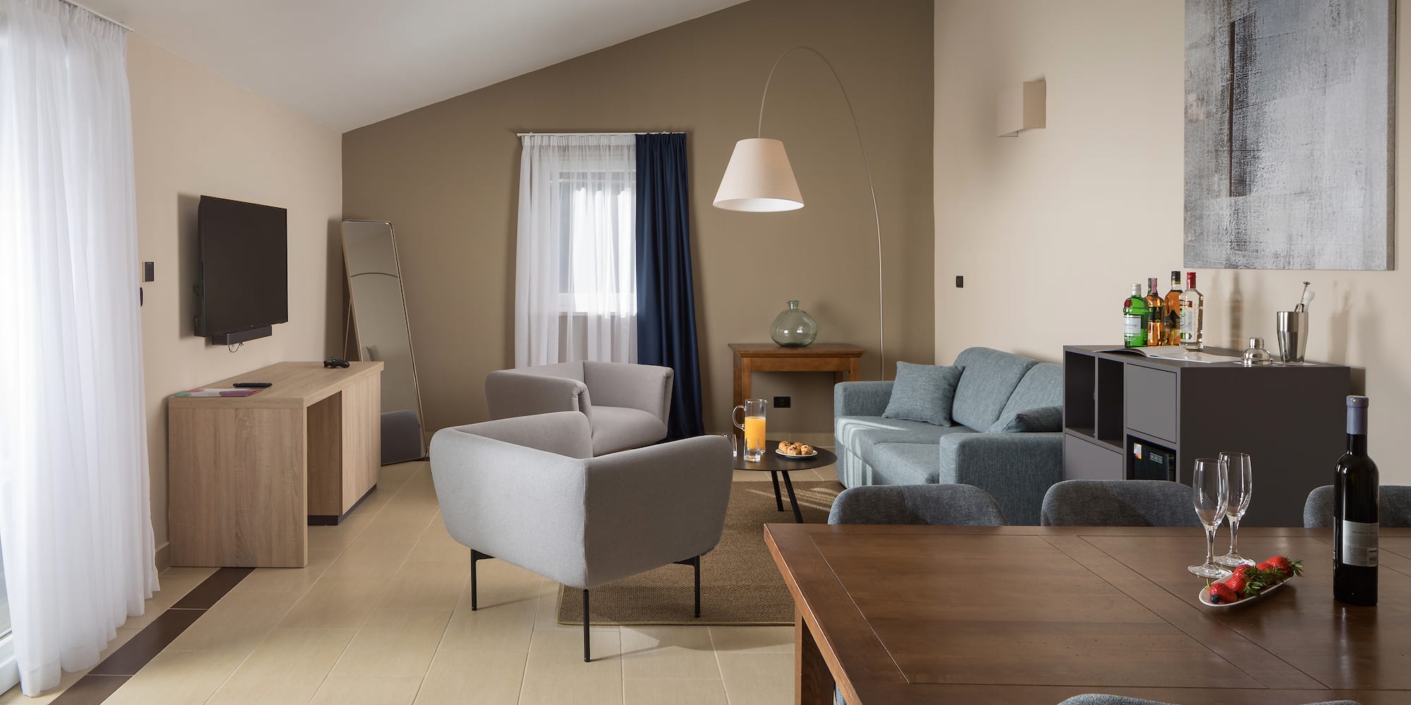 a living room with a tv and couches