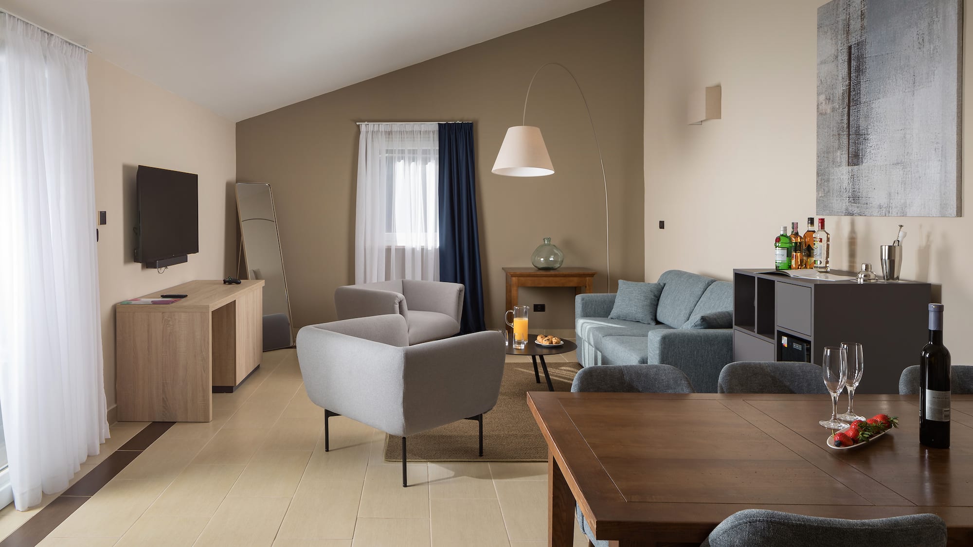 a living room with a tv and couches