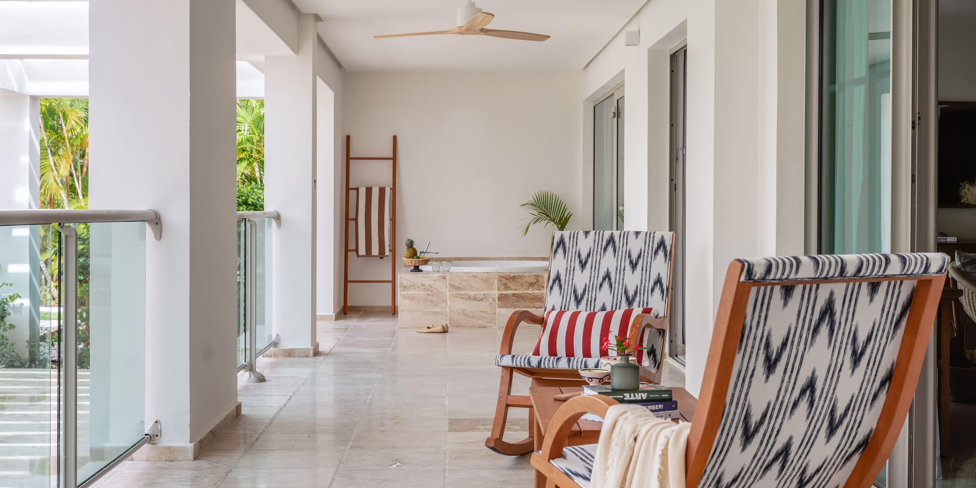 a patio with chairs and a bathtub