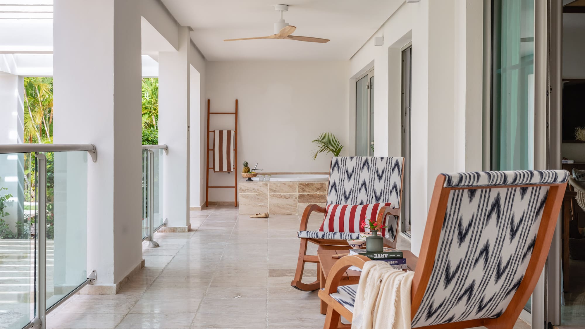 a patio with chairs and a bathtub