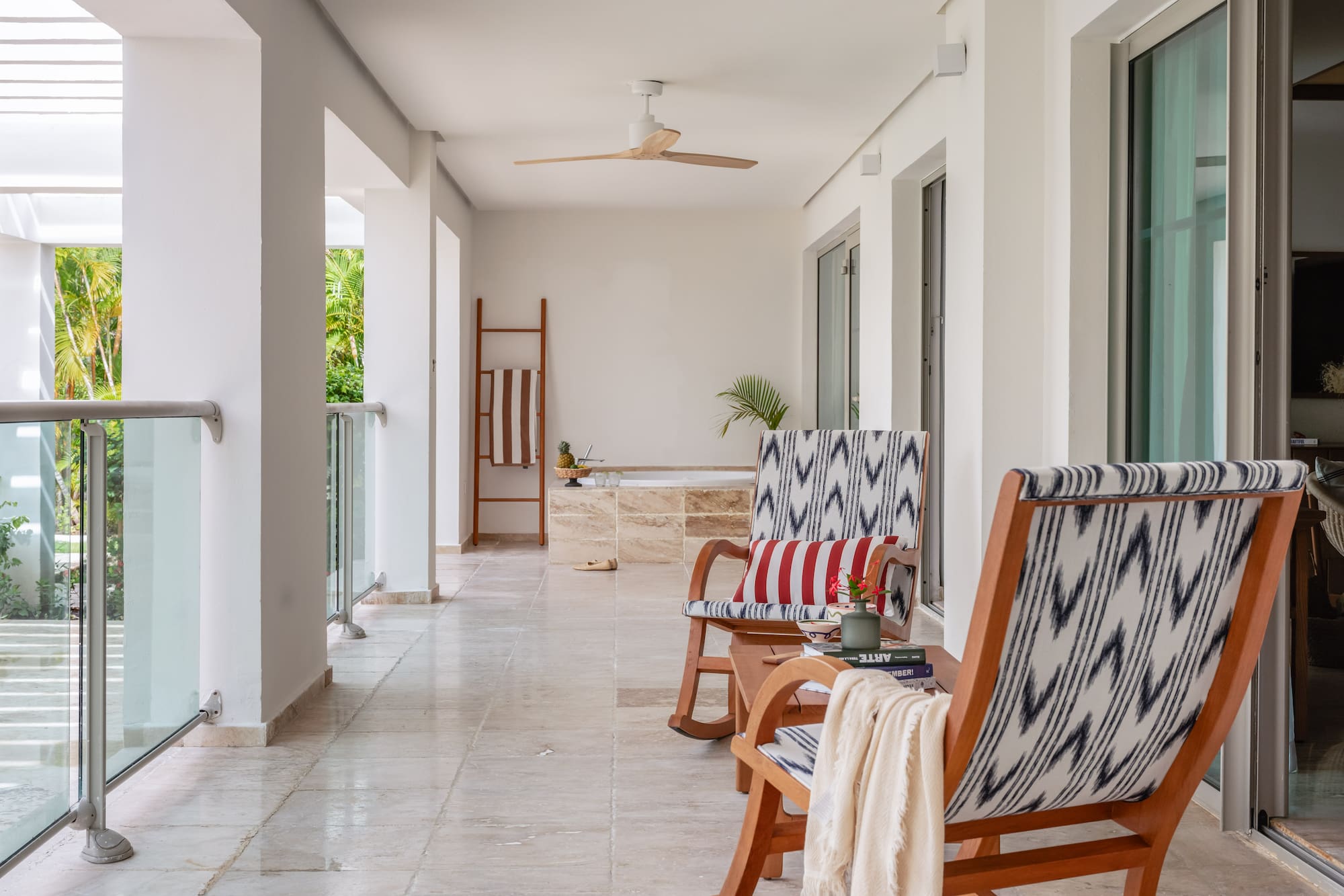 a patio with chairs and a bathtub