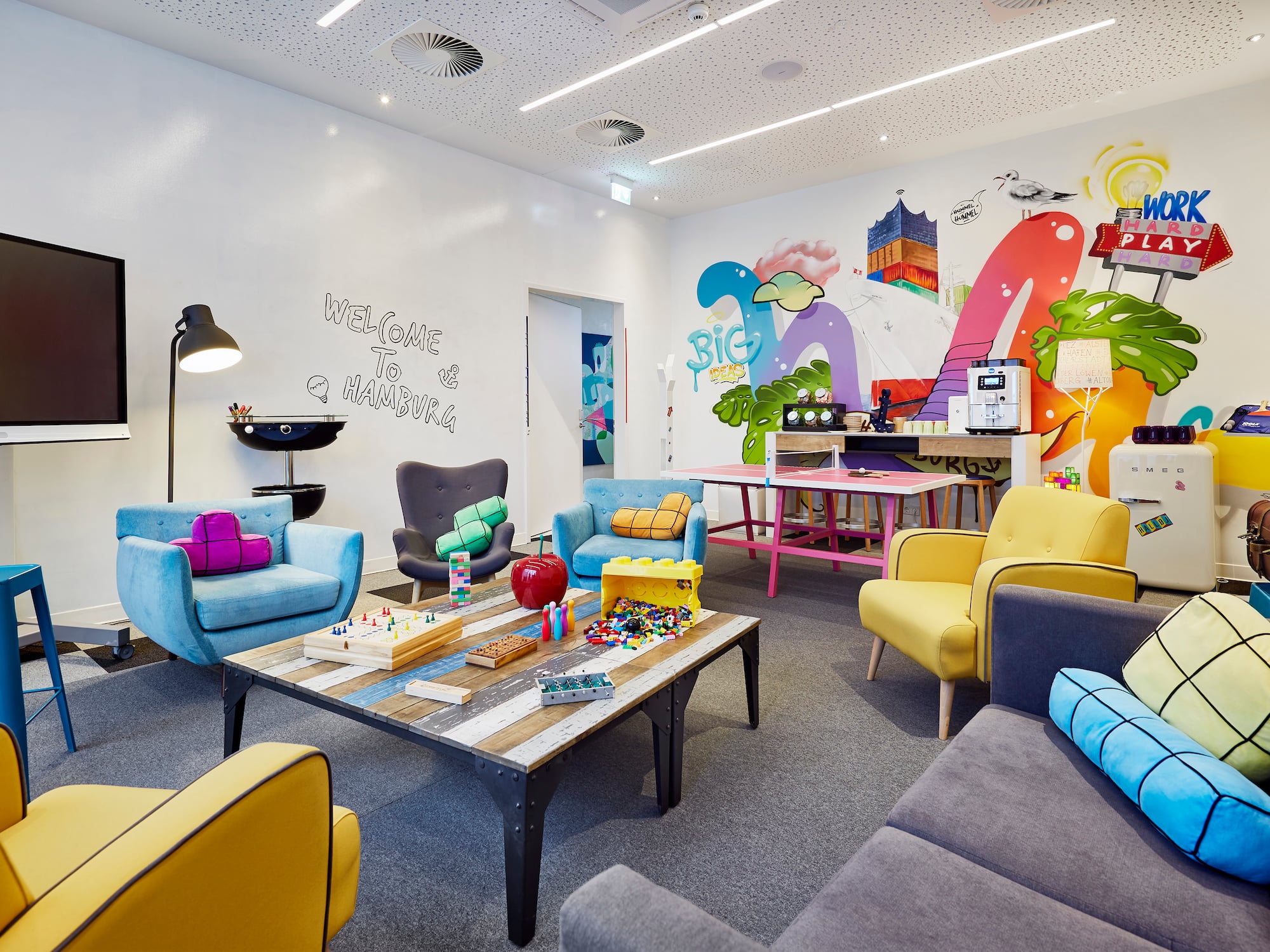 a room with colorful chairs and tables