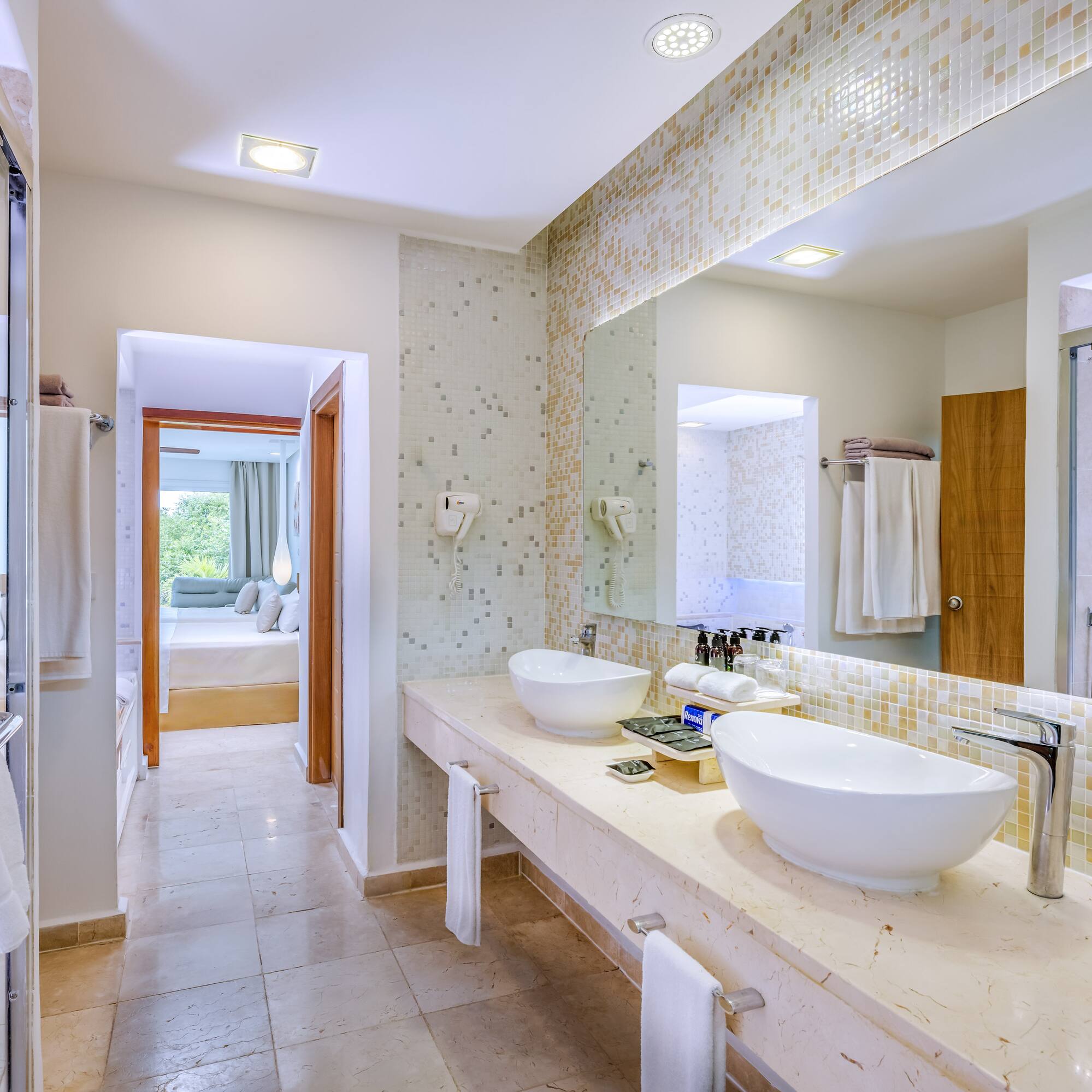 a bathroom with a large mirror and sinks