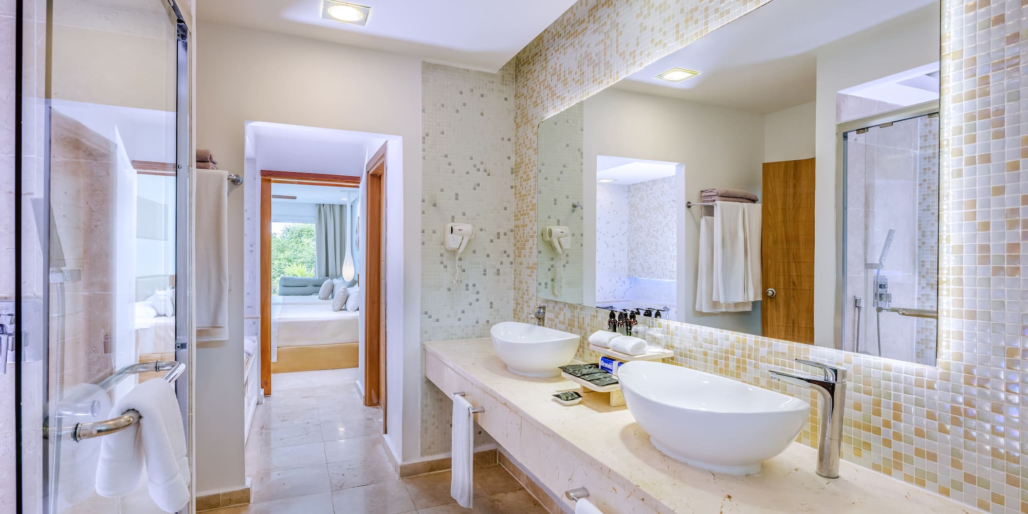 a bathroom with a large mirror and sinks