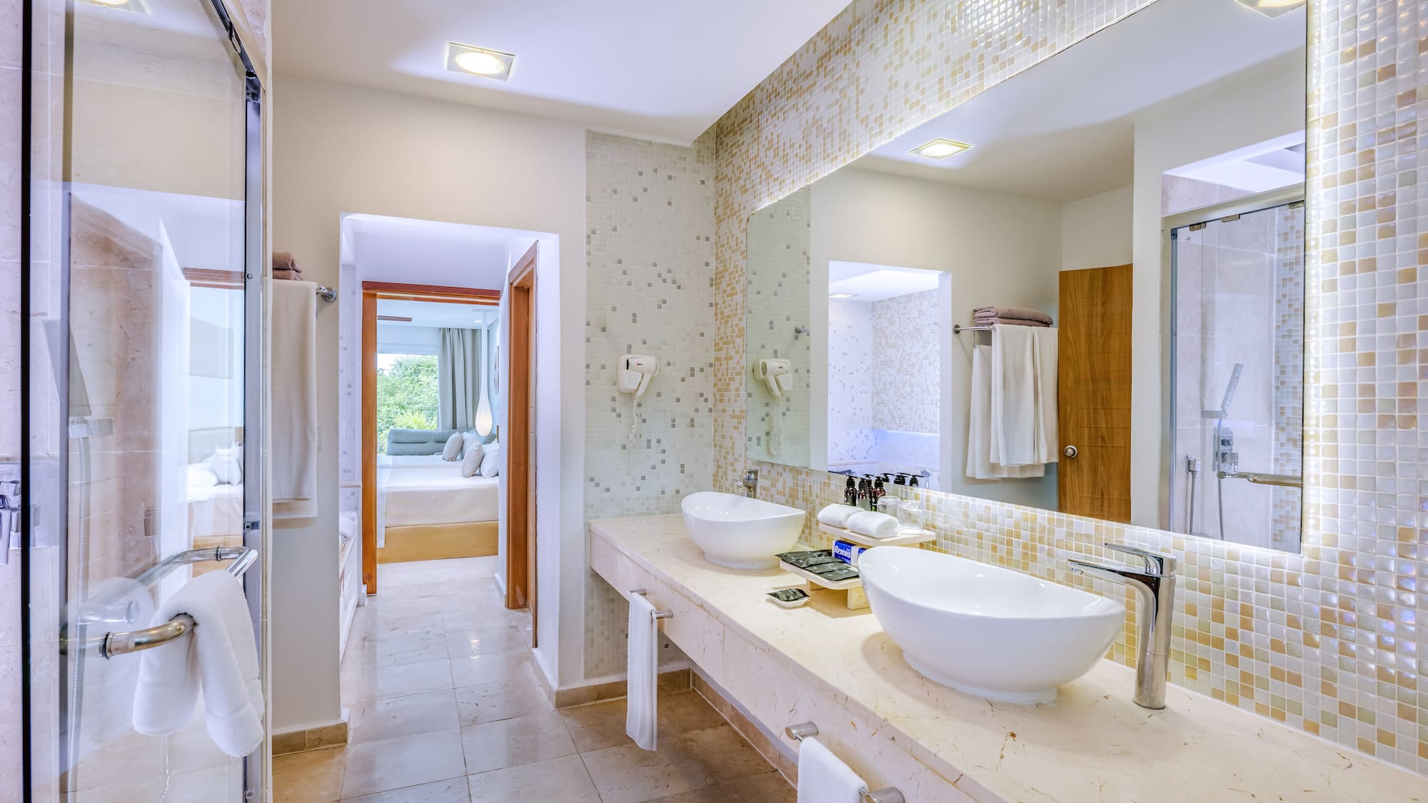 a bathroom with a large mirror and sinks