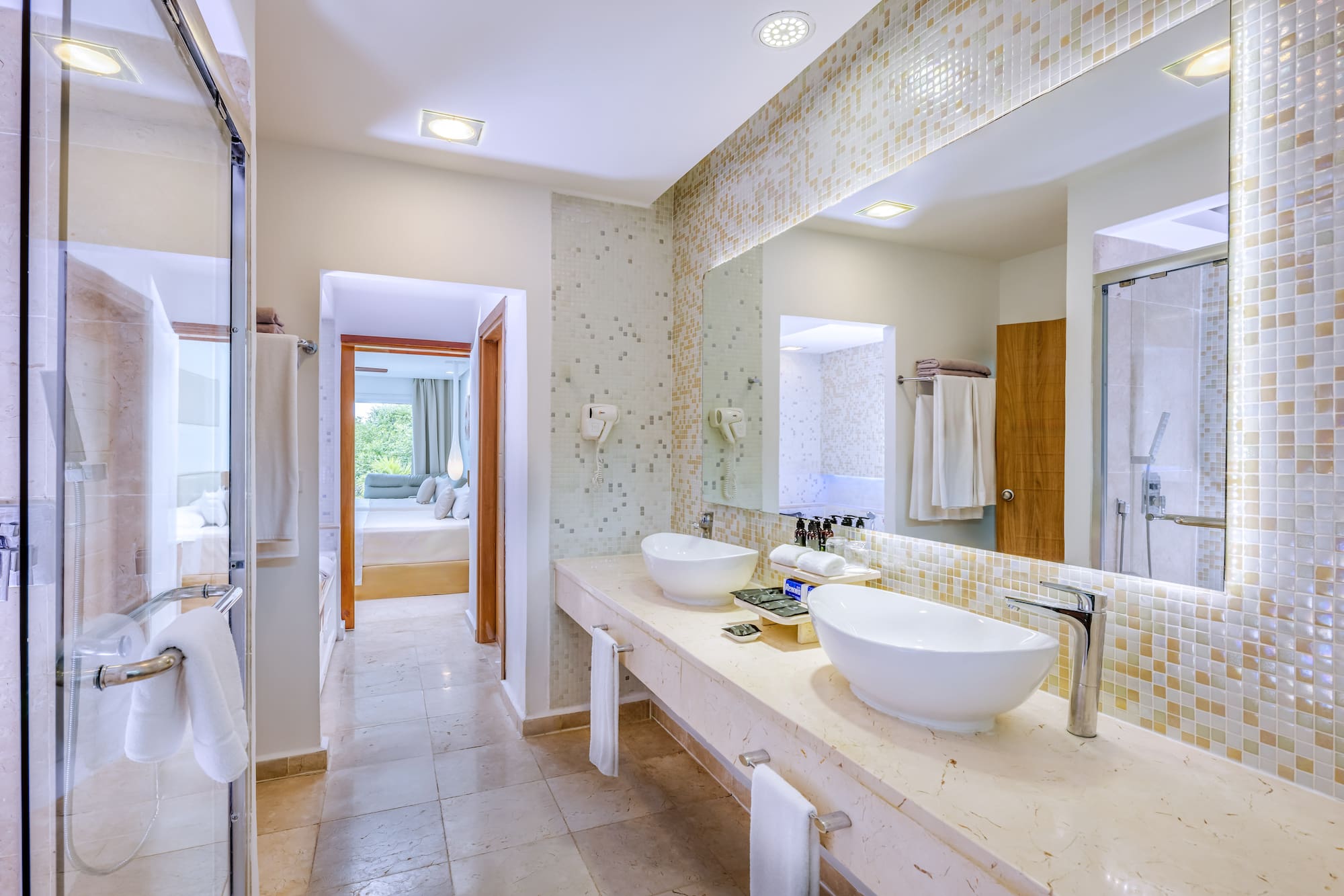a bathroom with a large mirror and sinks