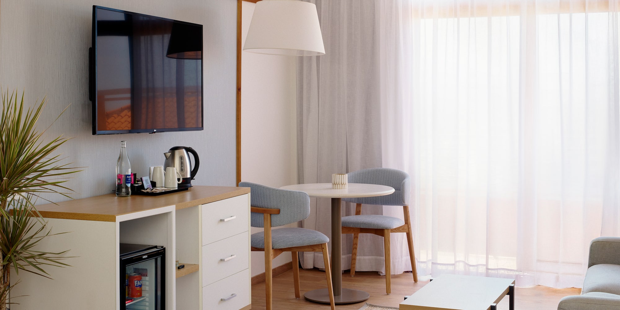 a room with a tv and a table