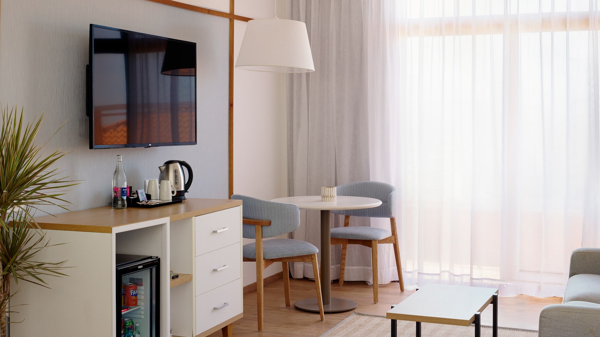 a room with a tv and a table