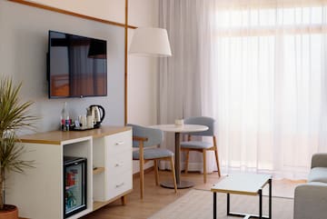 a room with a tv and a table