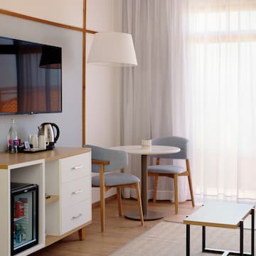 a room with a tv and a table