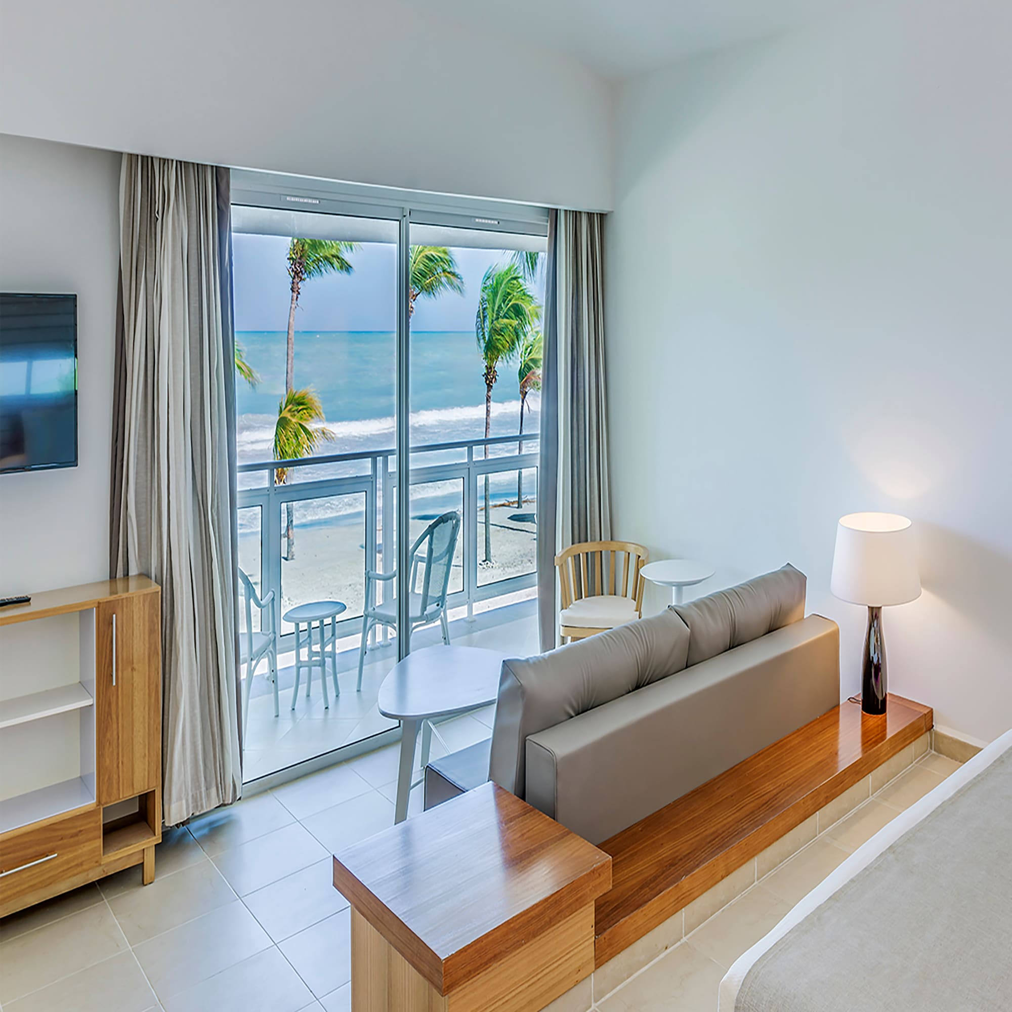 a room with a bed and a television