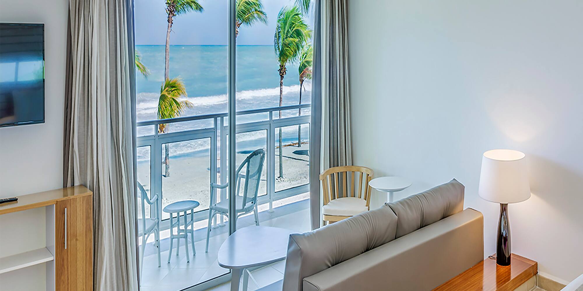 a room with a bed and a television