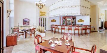 a room with a table and chairs