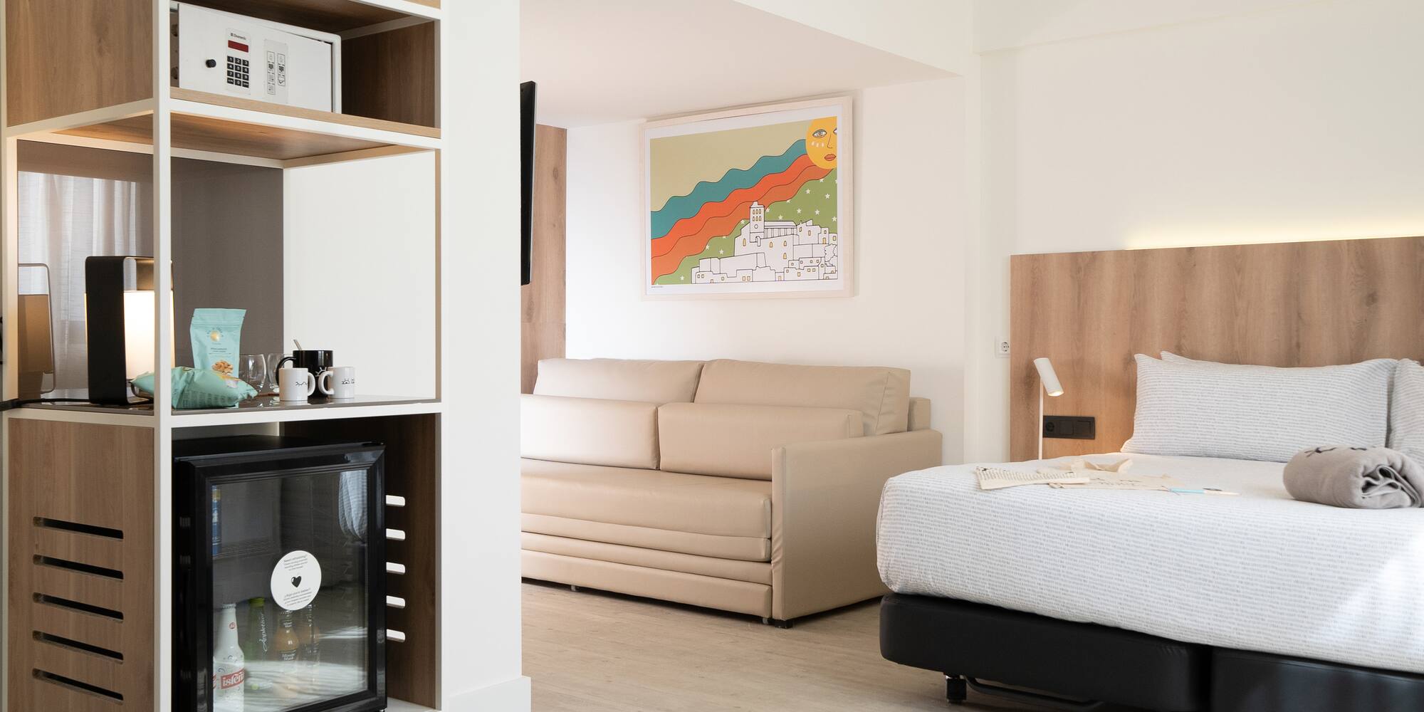 a room with a bed and a tv