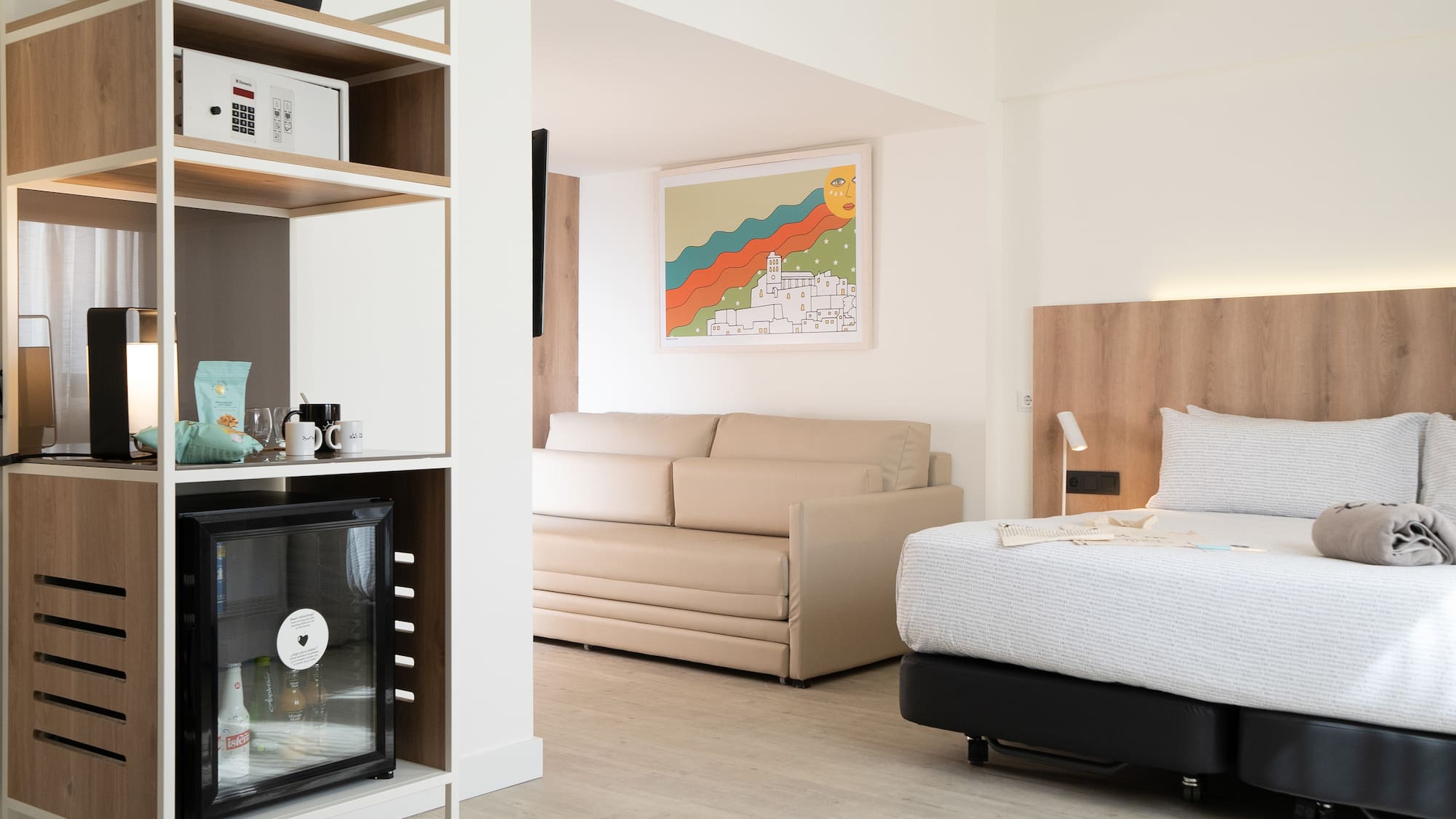 a room with a bed and a tv