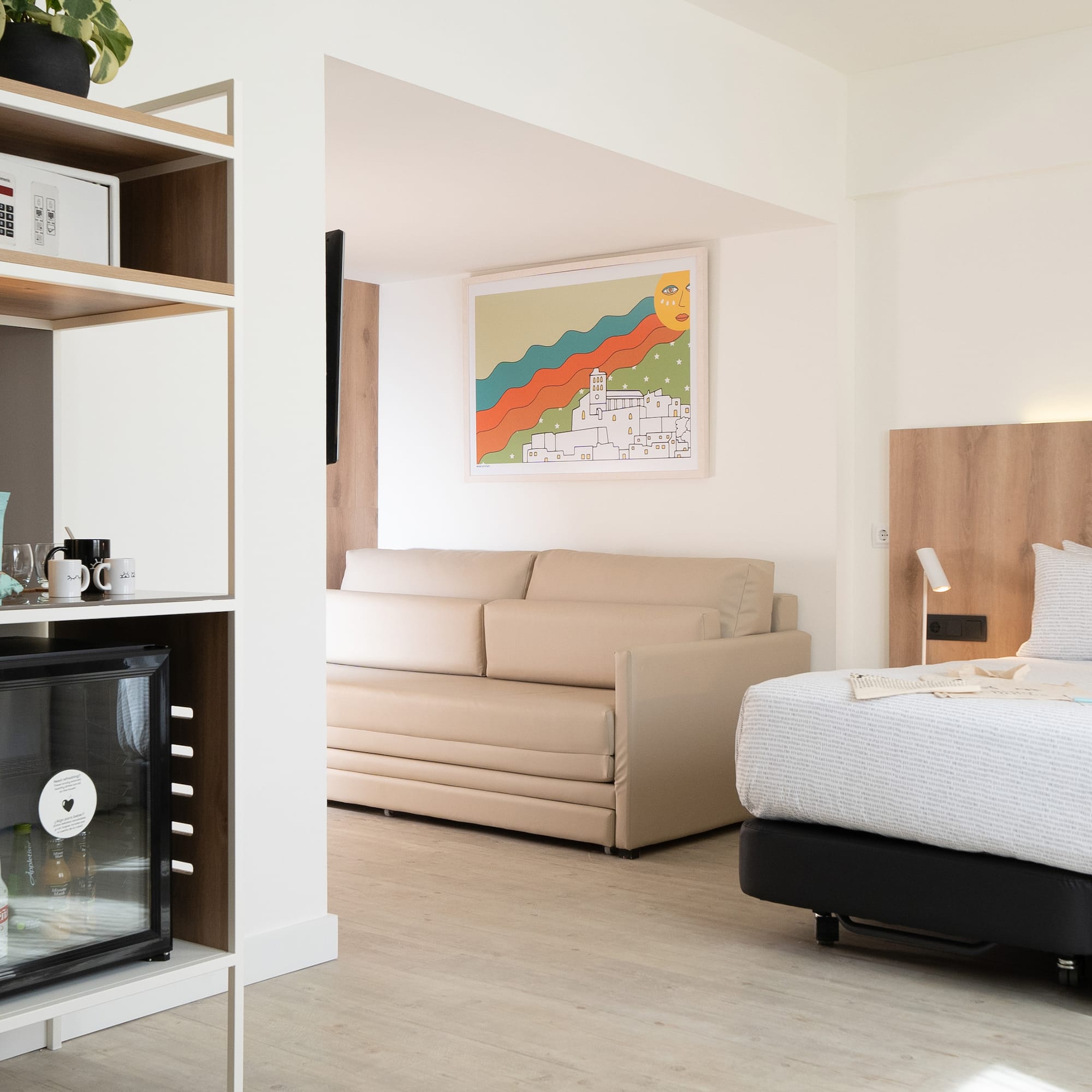 a room with a bed and a tv