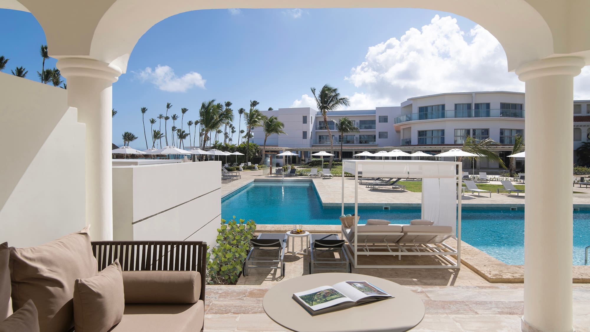 a pool with a couch and a book