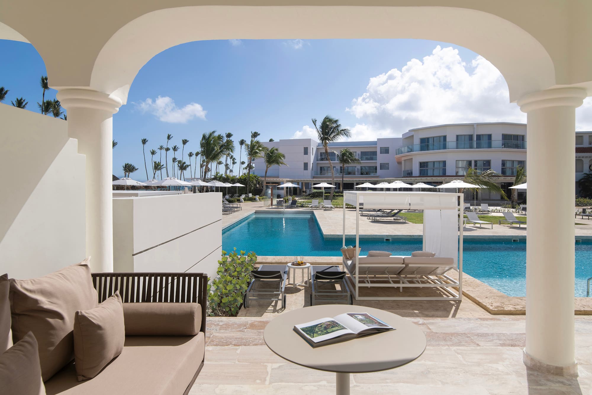 a pool with a couch and a book