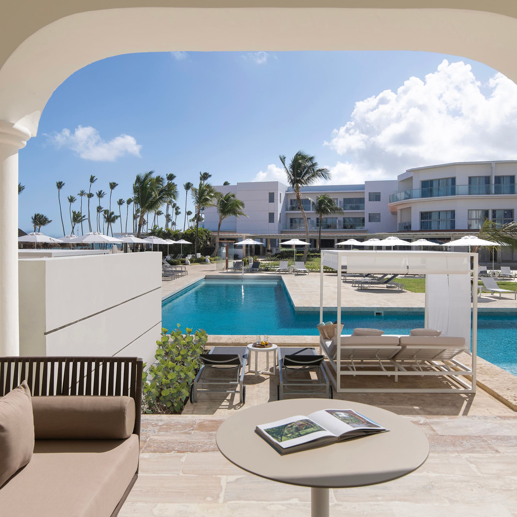 a pool with a couch and a book