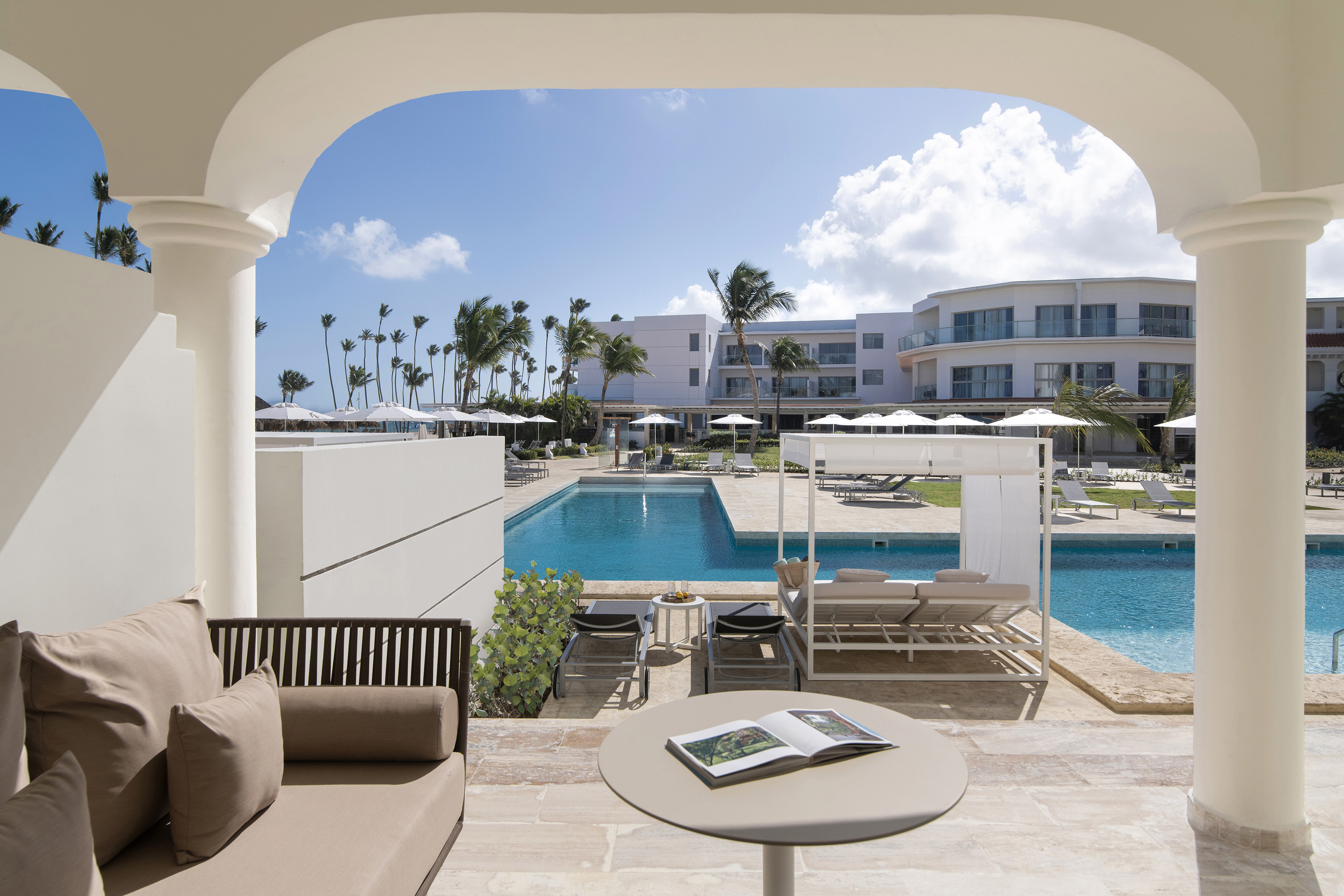 a pool with a couch and a book