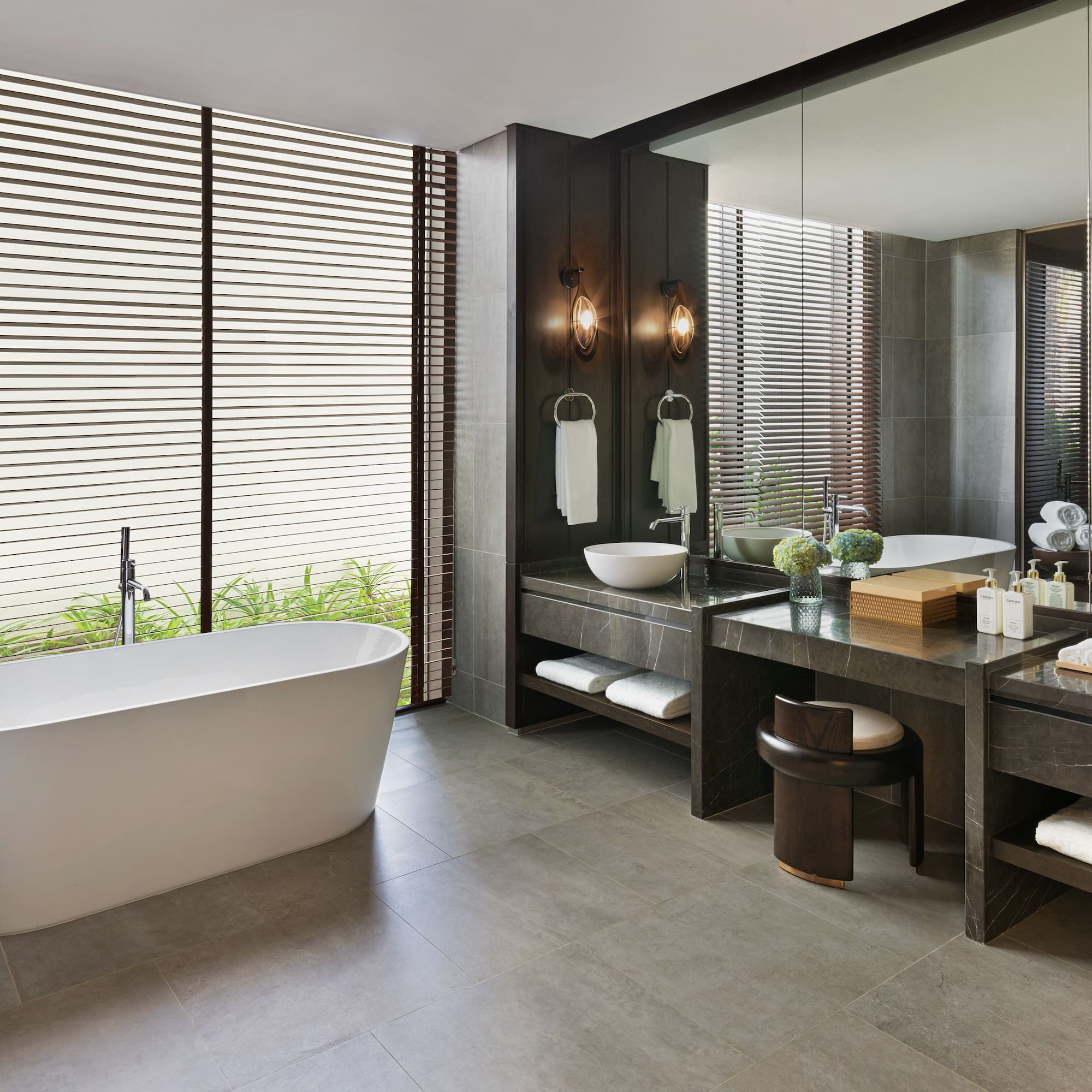 a bathroom with a tub and sink