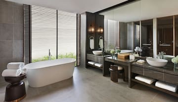 a bathroom with a tub and sink