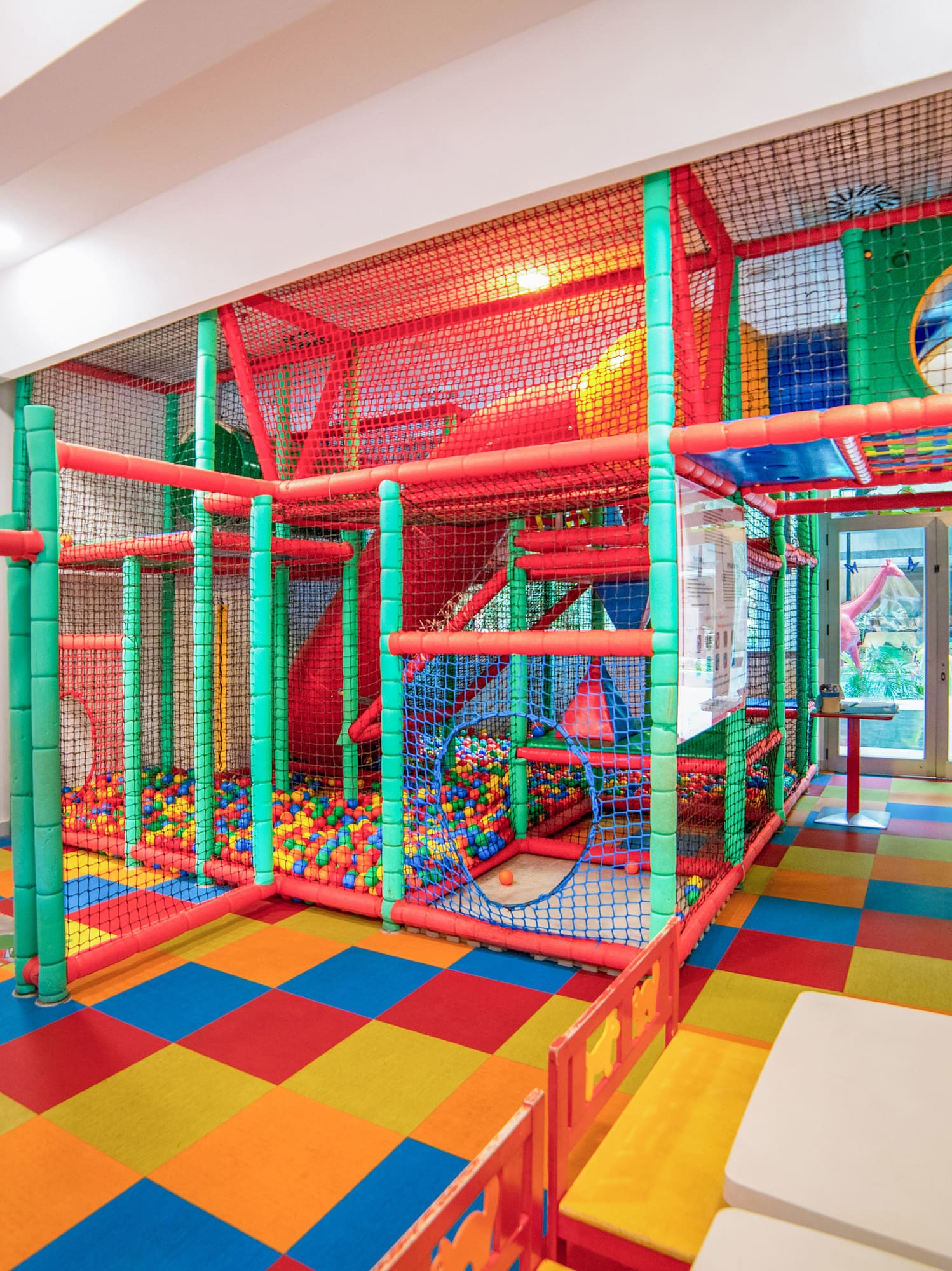 a play area with colorful balls and a slide